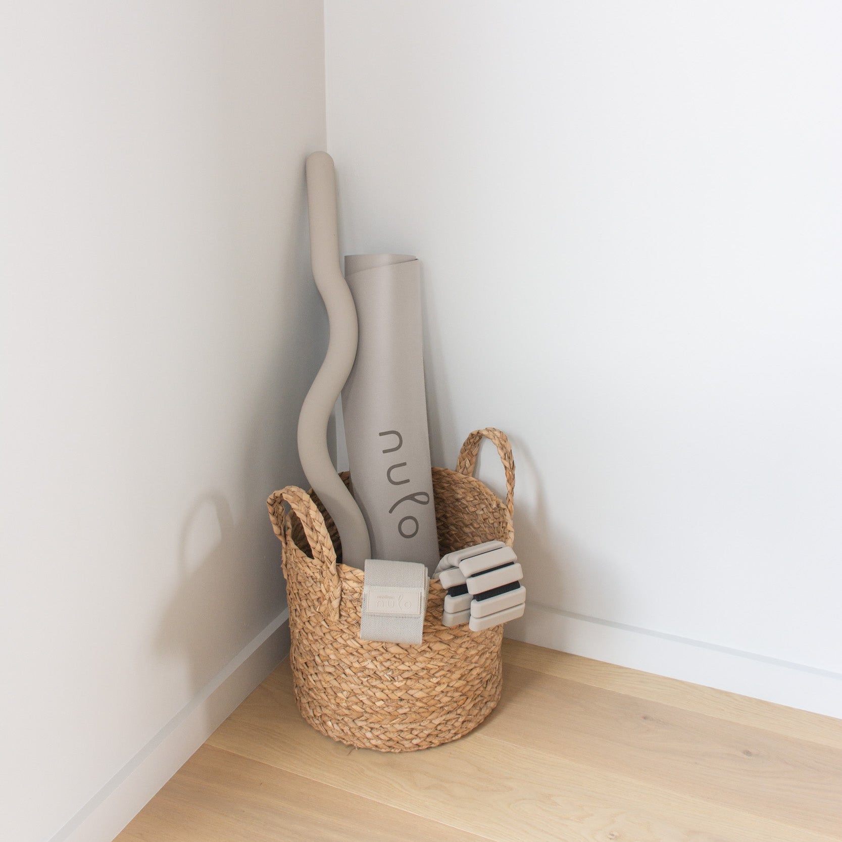 Premium Yoga & Pilates Mat with Carry Strap and beam in a grass basket - nulo